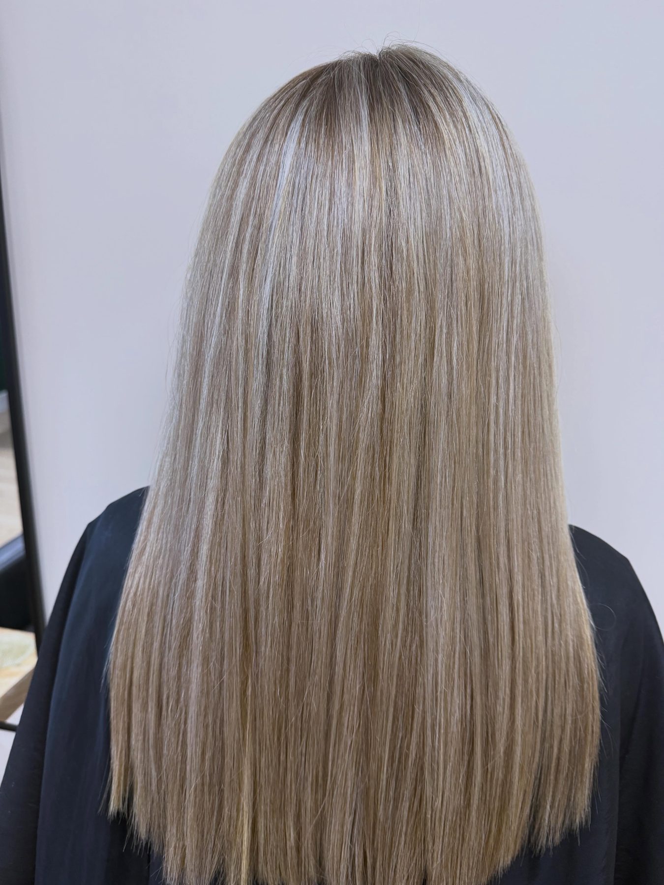Long, sleek ash blonde highlights finished in the salon