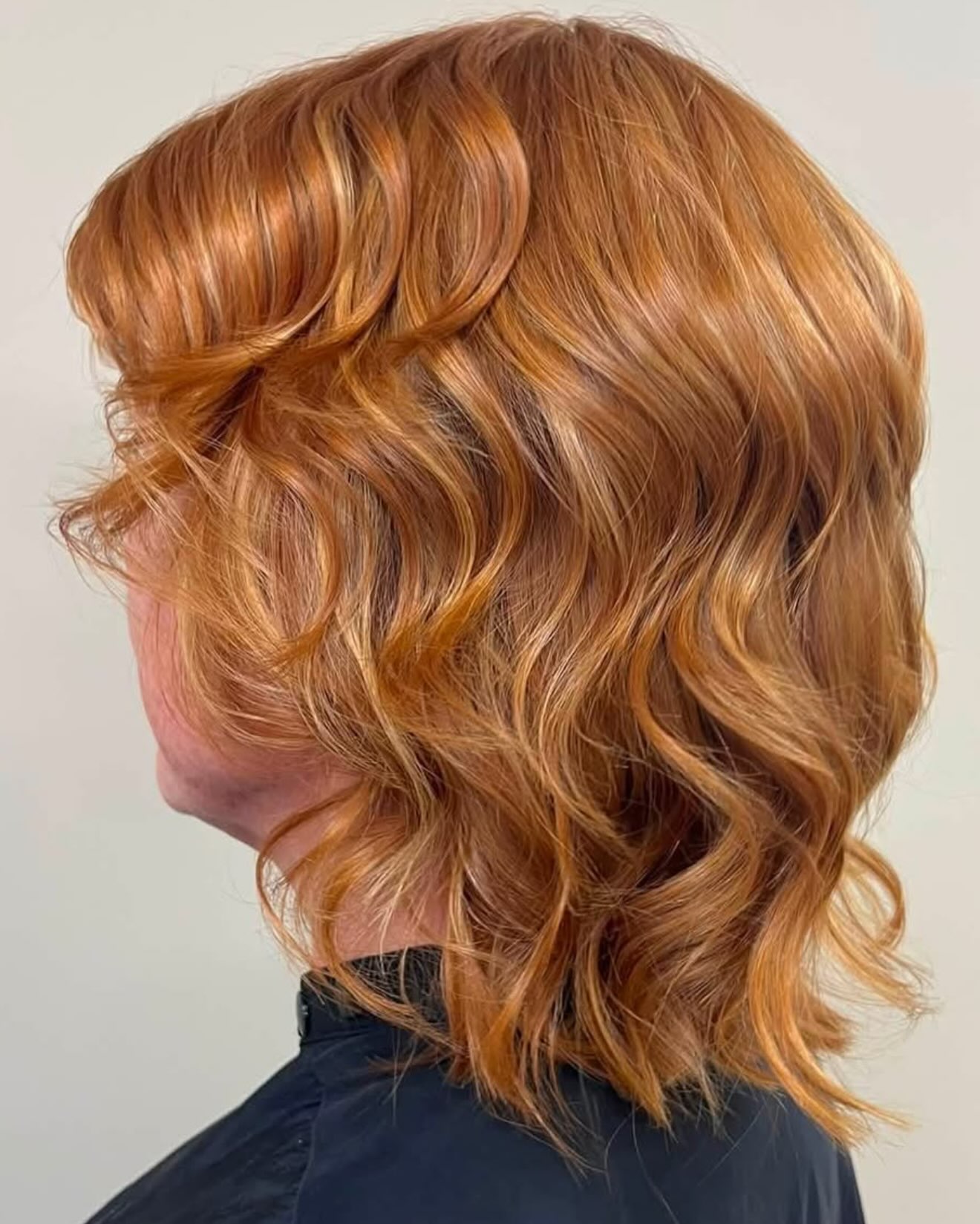Soft copper waves on a shoulder length cut