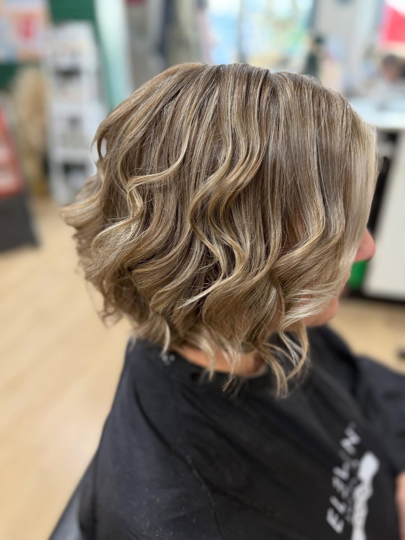 Curly bob with blended baby lights and a face frame